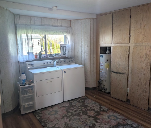 615 Duncan Ave, Cheboygan, MI 49721 - clothes washing area with gas water heater, washing machine and dryer, wood finished floors, and wooden walls