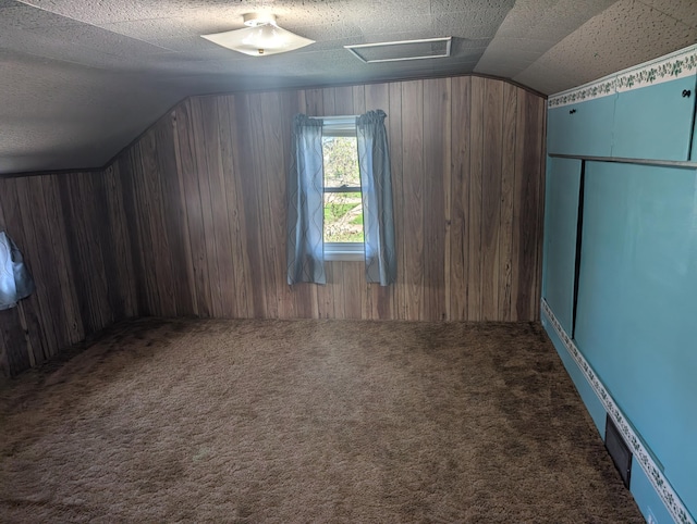 615 Duncan Ave, Cheboygan, MI 49721 - bonus room with lofted ceiling, carpet flooring, and wooden walls