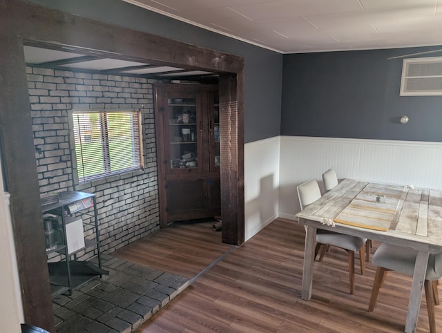 615 Duncan Ave, Cheboygan, MI 49721 - dining space featuring wainscoting and wood finished floors