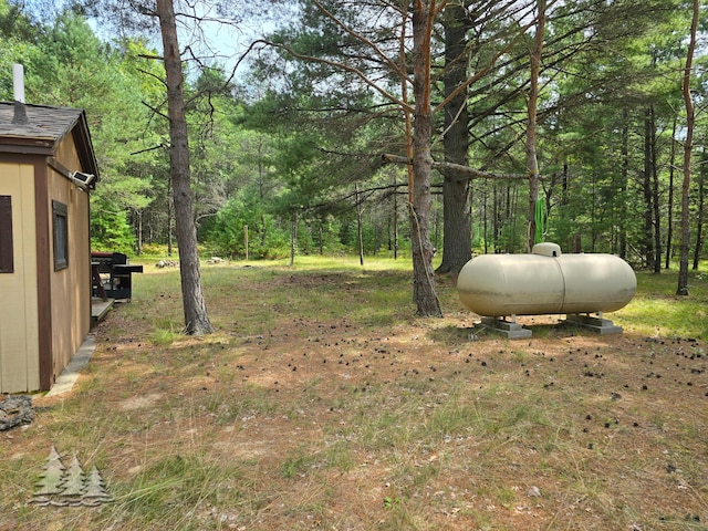 4097 Sunset Dr, Lewiston, MI 49756 - view of yard with a view of trees