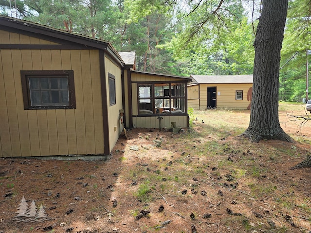 4097 Sunset Dr, Lewiston, MI 49756 - view of yard featuring a sunroom