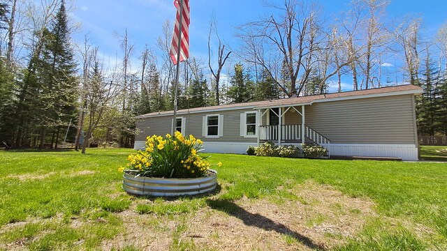 10340 US-23, Cheboygan, MI 49721 - view of front of house with a front lawn