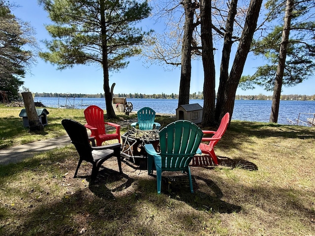 6299 Woodland Dr, Oscoda, MI 48750 - view of yard with an outdoor fire pit and a water view