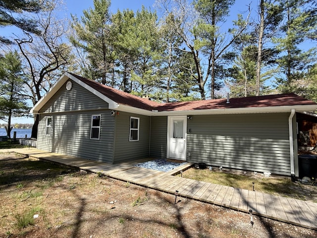 6299 Woodland Dr, Oscoda, MI 48750 - view of rear view of house