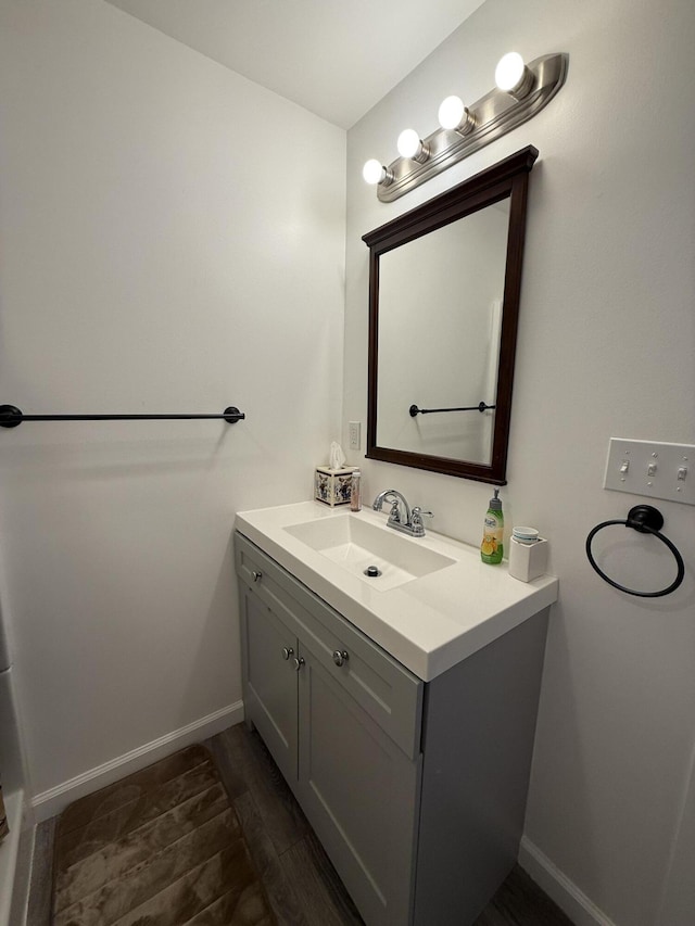 6299 Woodland Dr, Oscoda, MI 48750 - bathroom featuring vanity and baseboards
