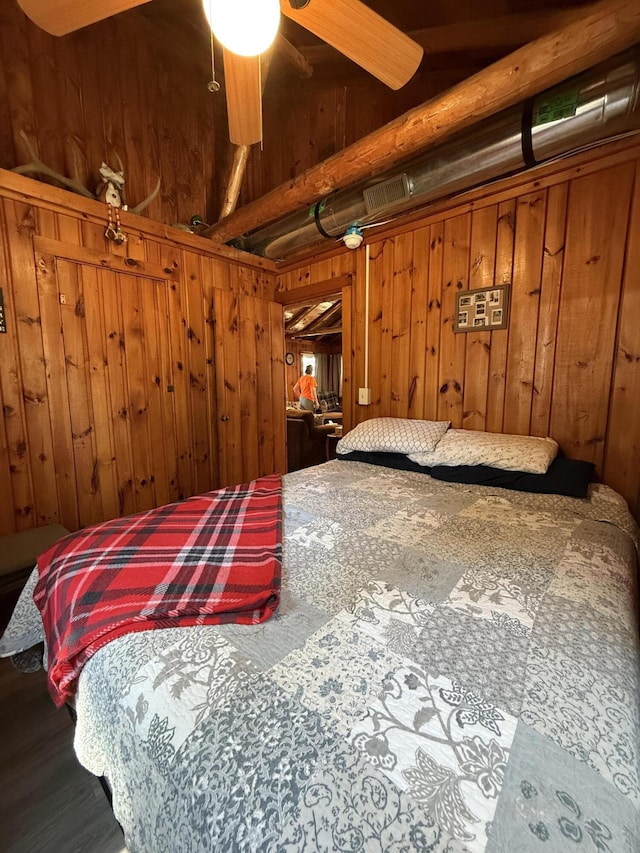 6299 Woodland Dr, Oscoda, MI 48750 - bedroom featuring wood walls