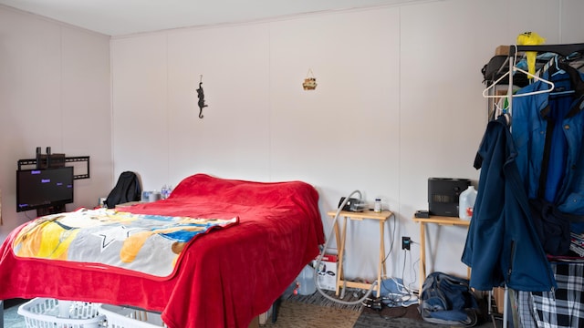 3182 W Houghton Lake Dr, Houghton Lake, MI 48629 - bedroom with a decorative wall