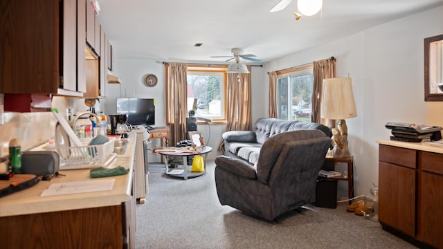 3182 W Houghton Lake Dr, Houghton Lake, MI 48629 - living area featuring dark colored carpet and ceiling fan