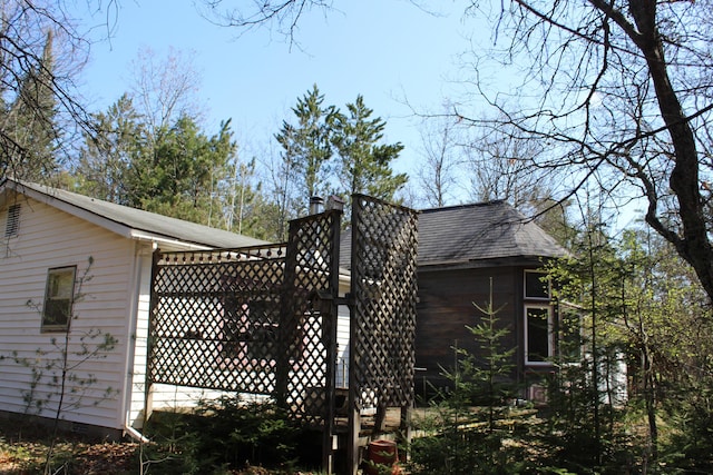 2032 W Oak Rd, Luzerne, MI 48636 - view of home's exterior featuring a shingled roof