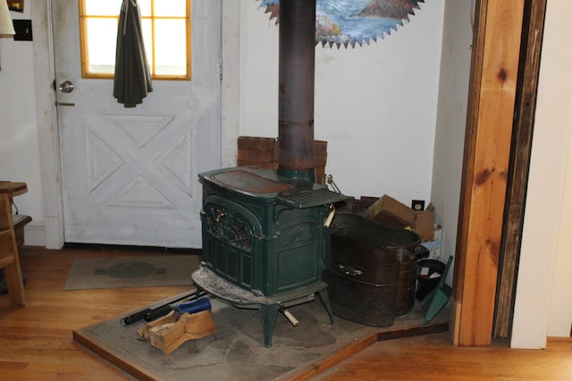 2032 W Oak Rd, Luzerne, MI 48636 - detailed view of a wood stove and wood finished floors