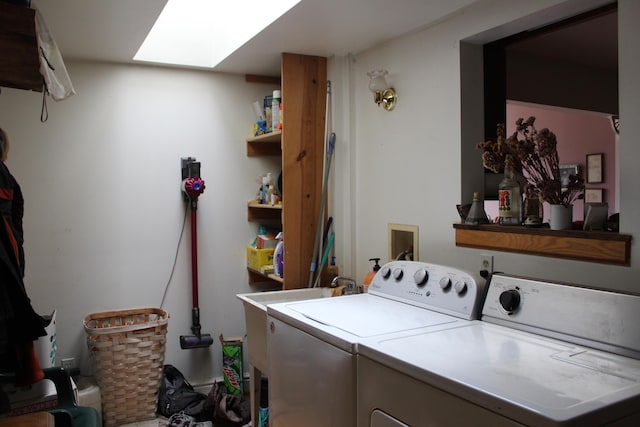 2032 W Oak Rd, Luzerne, MI 48636 - laundry area featuring washing machine and dryer and a skylight