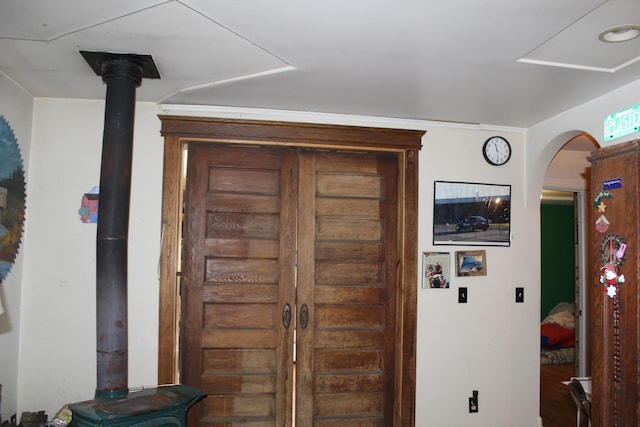 2032 W Oak Rd, Luzerne, MI 48636 - foyer entrance with a wood stove and arched walkways