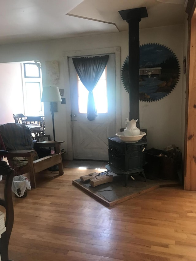 2032 W Oak Rd, Luzerne, MI 48636 - foyer with a wood stove and light wood-style floors