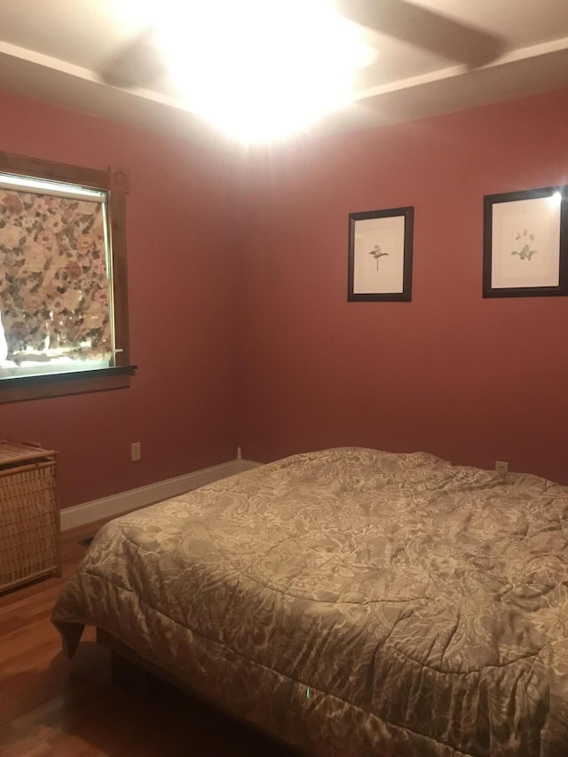 2032 W Oak Rd, Luzerne, MI 48636 - bedroom featuring wood finished floors