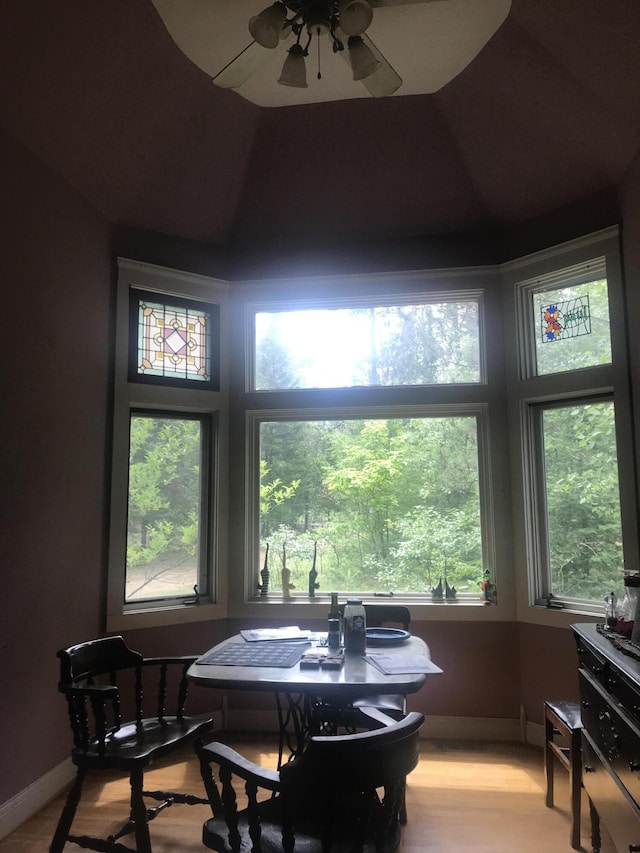 2032 W Oak Rd, Luzerne, MI 48636 - dining area featuring ceiling fan, healthy amount of natural light, and light wood-style flooring