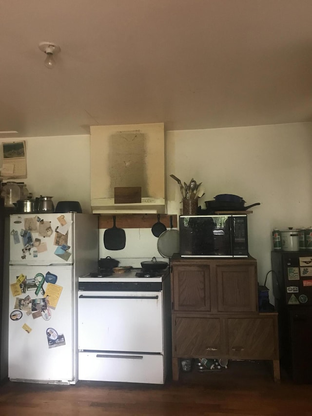 2032 W Oak Rd, Luzerne, MI 48636 - kitchen with freestanding refrigerator and dark wood-style flooring