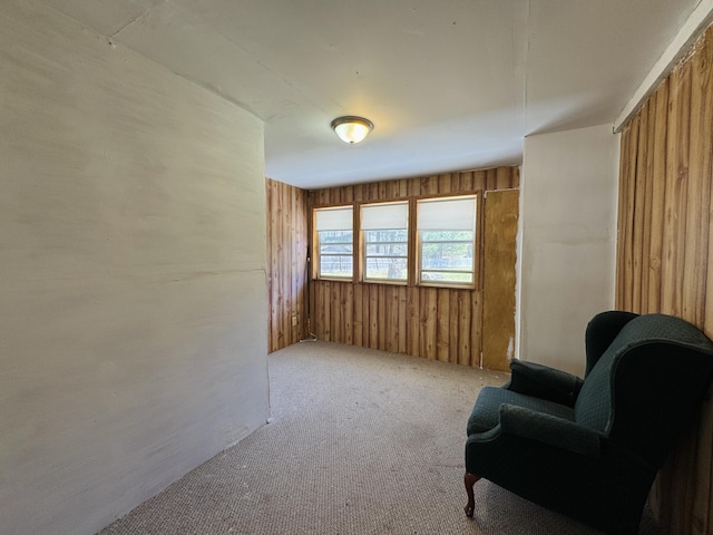 1654 Opland Rd, Gladwin, MI 48624 - sitting room featuring carpet flooring and wooden walls