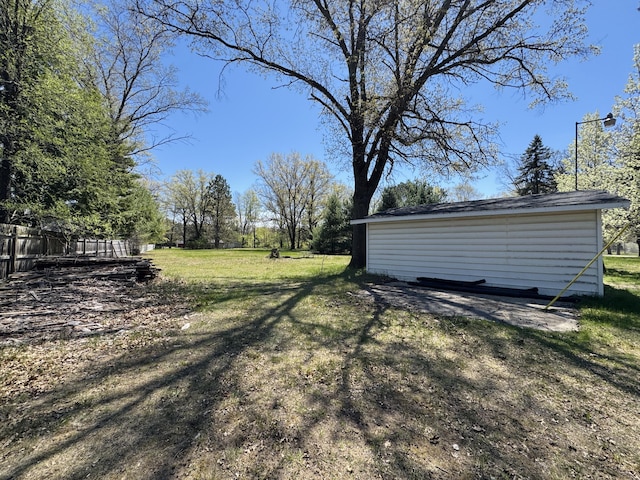 1654 Opland Rd, Gladwin, MI 48624 - view of green lawn featuring an outdoor structure