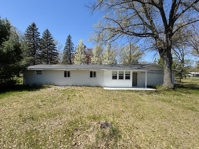 1654 Opland Rd, Gladwin, MI 48624 - rear view of property with a lawn and a patio