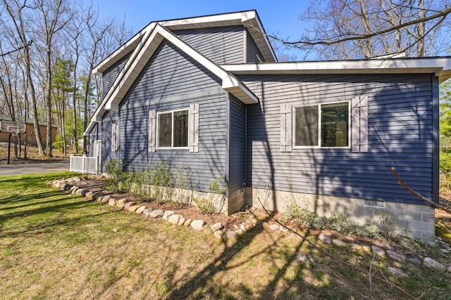 343 Crystal Ln, Roscommon, MI 48653 - view of side of property with a lawn and a cooling unit