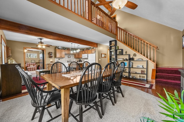 343 Crystal Ln, Roscommon, MI 48653 - dining space with a ceiling fan, wood finished floors, stairs, and beamed ceiling