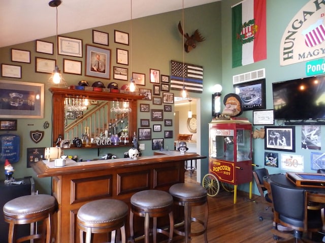 7928 Blueberry Ln, Johannesburg, MI 49751 - indoor dry bar featuring wood finished floors and high vaulted ceiling