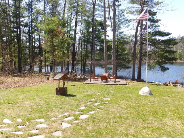 7928 Blueberry Ln, Johannesburg, MI 49751 - view of green lawn with a water view and a gazebo