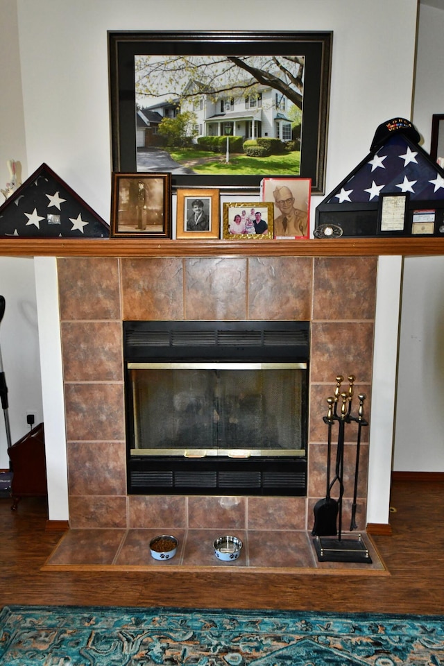 4930 Warrington Way, Gladwin, MI 48624 - detailed view of wood finished floors and a fireplace