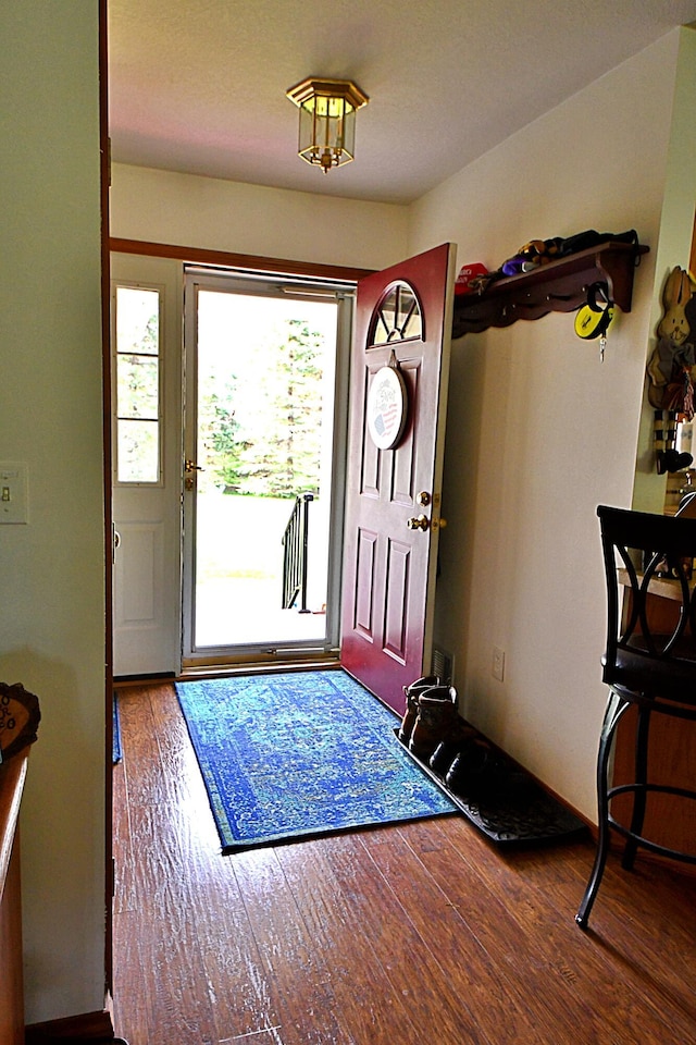 4930 Warrington Way, Gladwin, MI 48624 - foyer entrance featuring wood finished floors