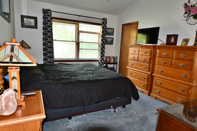 4930 Warrington Way, Gladwin, MI 48624 - bedroom featuring lofted ceiling and carpet flooring