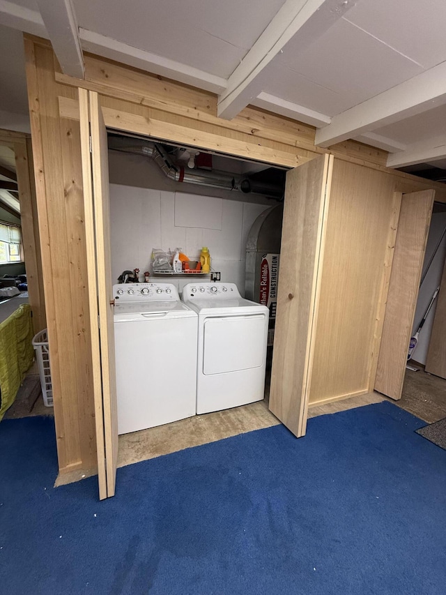 below grade area featuring independent washer and dryer and carpet