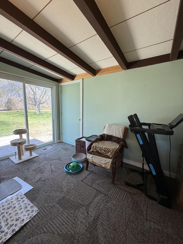 sunroom featuring beamed ceiling