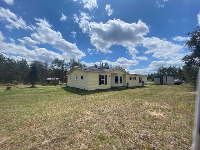 1364 Lakeview Dr, Mio, MI 48647 - view of home's exterior featuring a lawn and crawl space