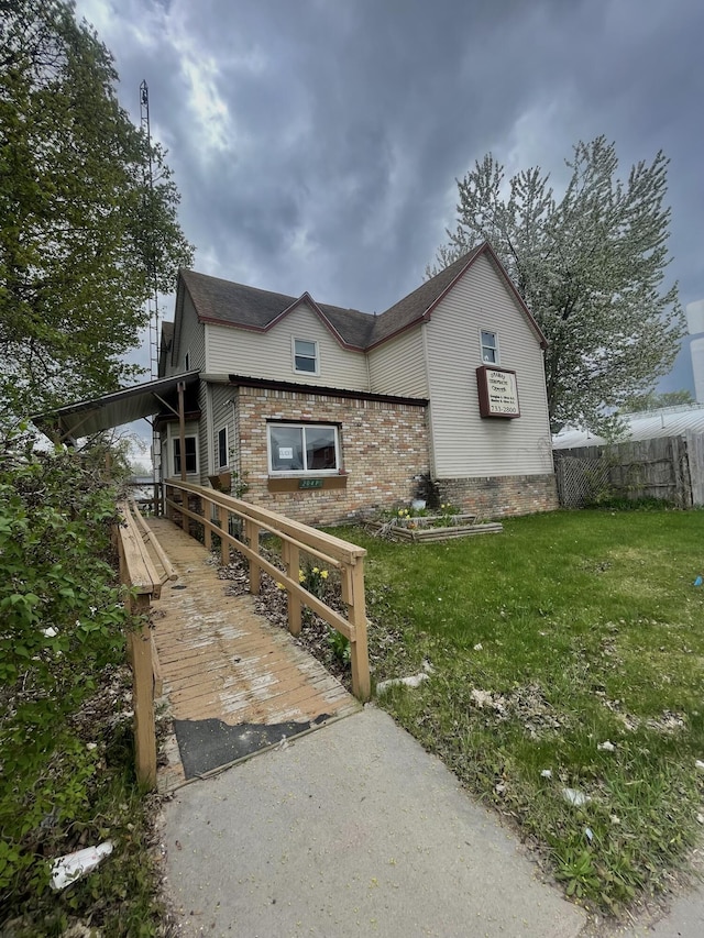 20417 State St, Onaway, MI 49765 - view of front of house featuring brick siding