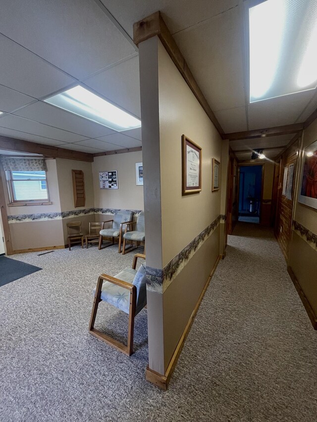 20417 State St, Onaway, MI 49765 - corridor featuring carpet floors, a paneled ceiling, and baseboards