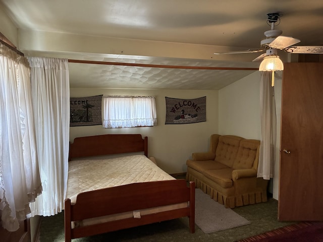 bedroom featuring carpet and a ceiling fan
