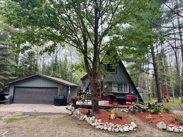 2733 Timberlane Trl, Grayling, MI 49738 - a-frame style home with an outbuilding and a detached garage