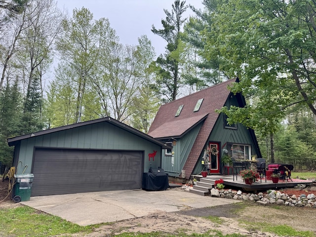 2733 Timberlane Trl, Grayling, MI 49738 - a-frame home with a deck and roof with shingles