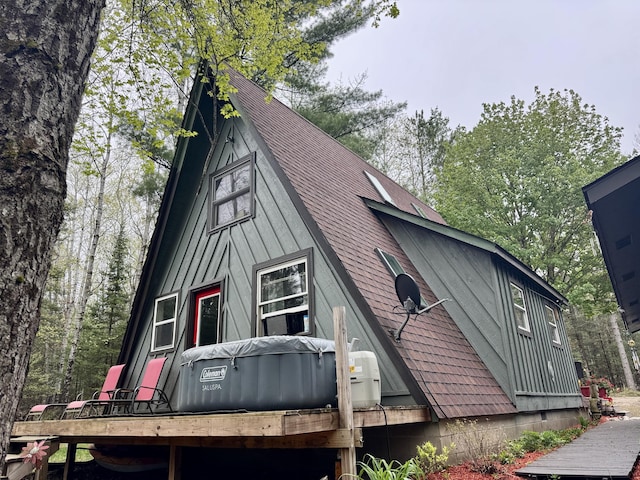 2733 Timberlane Trl, Grayling, MI 49738 - view of side of home featuring roof with shingles
