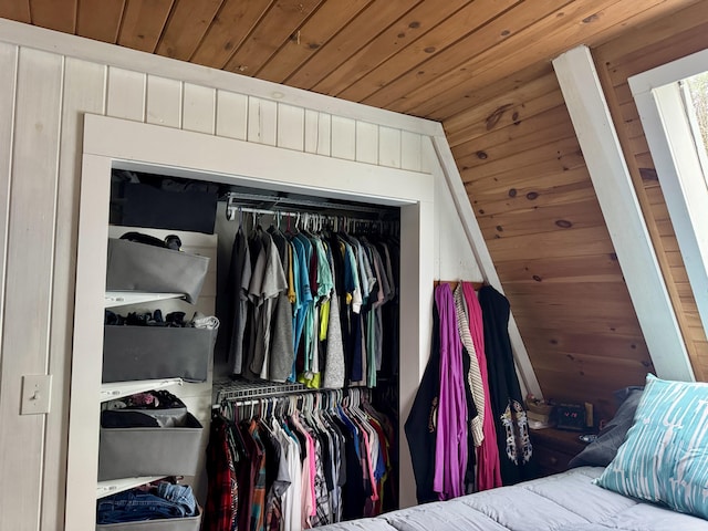 2733 Timberlane Trl, Grayling, MI 49738 - bedroom featuring wooden ceiling, a closet, and wood walls