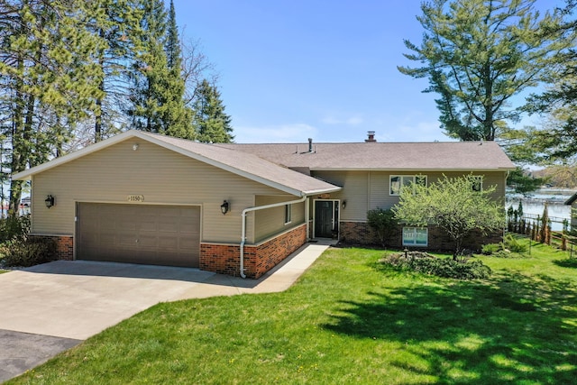 split level home with brick siding, a garage, and concrete driveway
