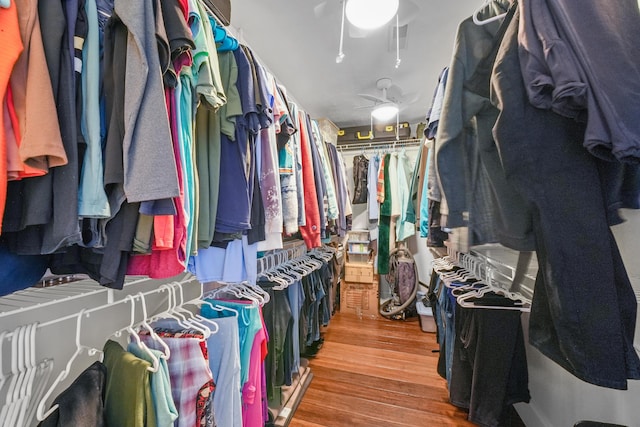 spacious closet featuring wood finished floors and a ceiling fan