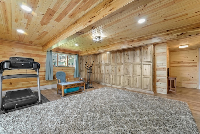 exercise room featuring wood finished floors, wooden walls, wood ceiling, and recessed lighting