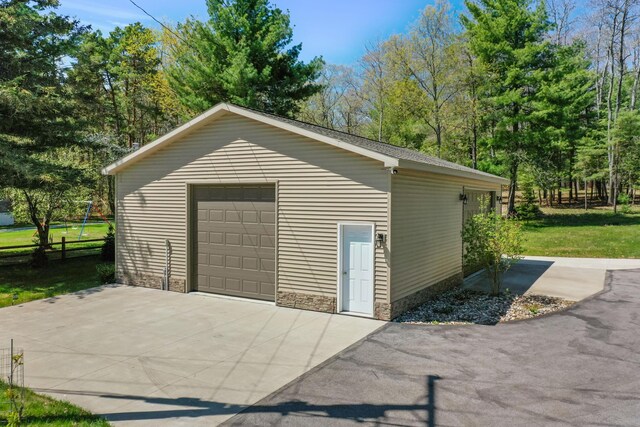 detached garage with fence