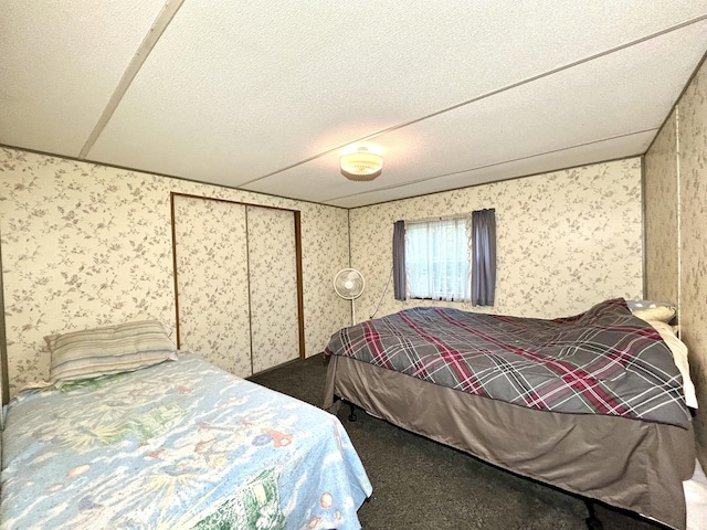 8448 Heatherton Cir, Mancelona, MI 49659 - bedroom with wallpapered walls and carpet floors