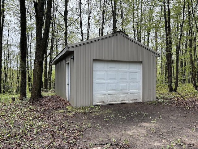 8448 Heatherton Cir, Mancelona, MI 49659 - detached garage with a wooded view