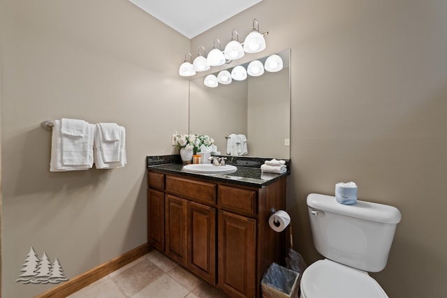 916C Chardonnay Ln, Lewiston, MI 49756 - bathroom featuring toilet, vanity, baseboards, and tile patterned flooring