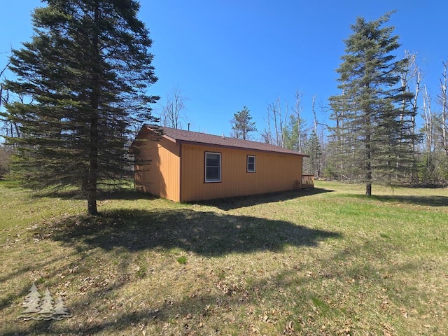 4795 Bruce Dr, Lewiston, MI 49756 - view of home's exterior with a yard and an outbuilding