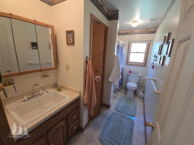 4795 Bruce Dr, Lewiston, MI 49756 - bathroom with toilet, vanity, and curtained shower