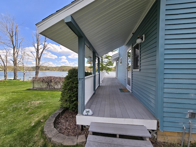 2623 W Dixon Lake Dr, Gaylord, MI 49735 - wooden deck featuring a water view and a lawn